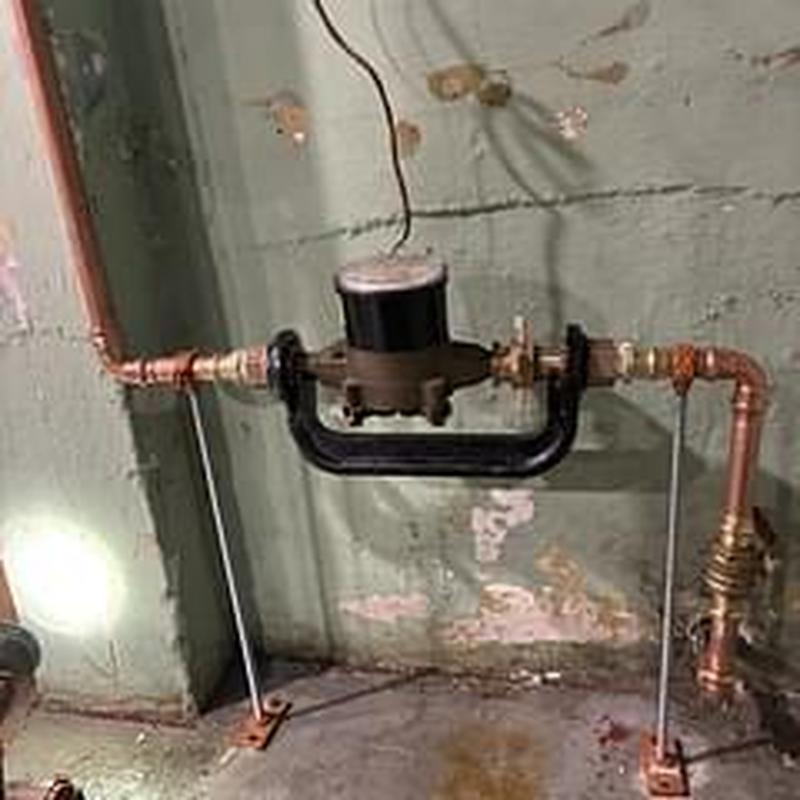 Water meter yoke and main shut off installation