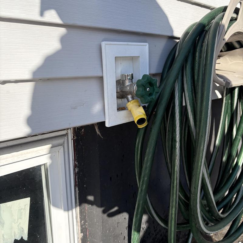 Frost-free outdoor silcock with attached garden hose