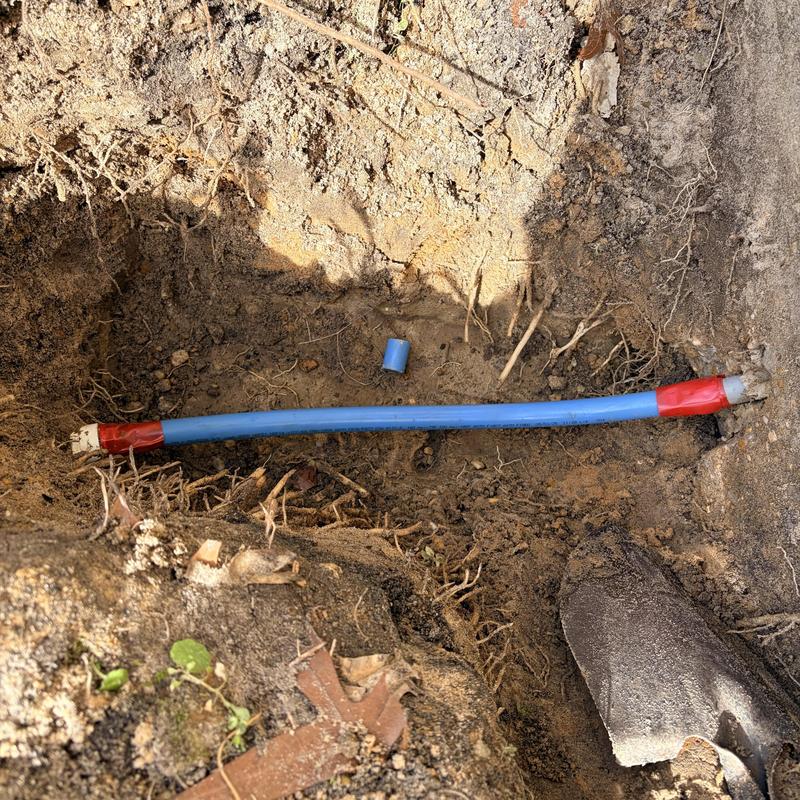 Polybutylene water service line in ground excavation