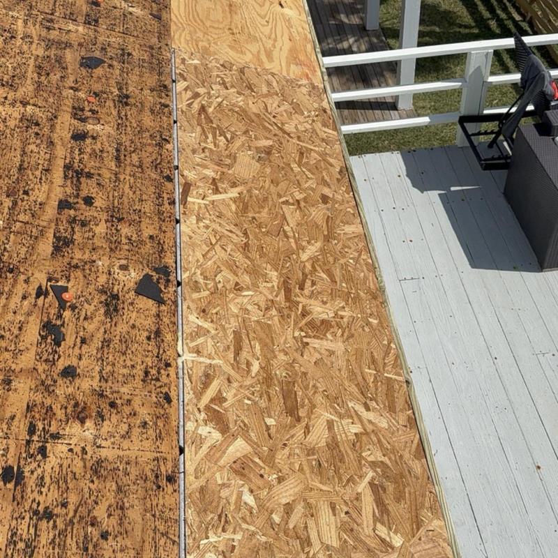 Roof decking replacement showing old and new plywood panels