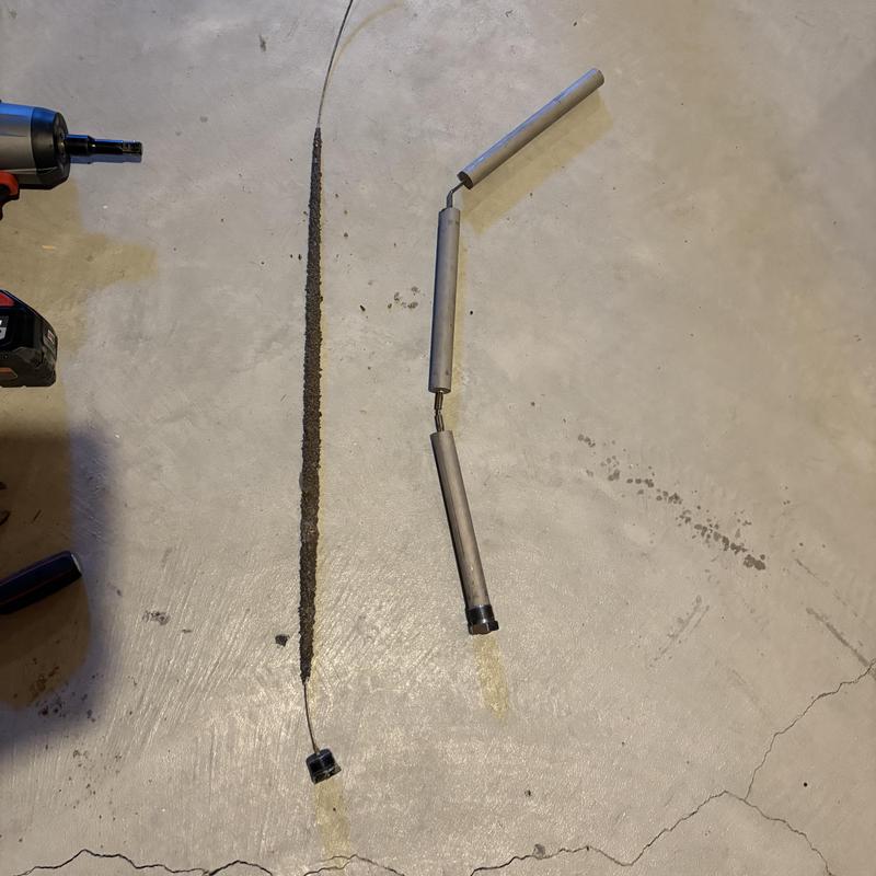 Water heater anode rod removed and replaced on floor