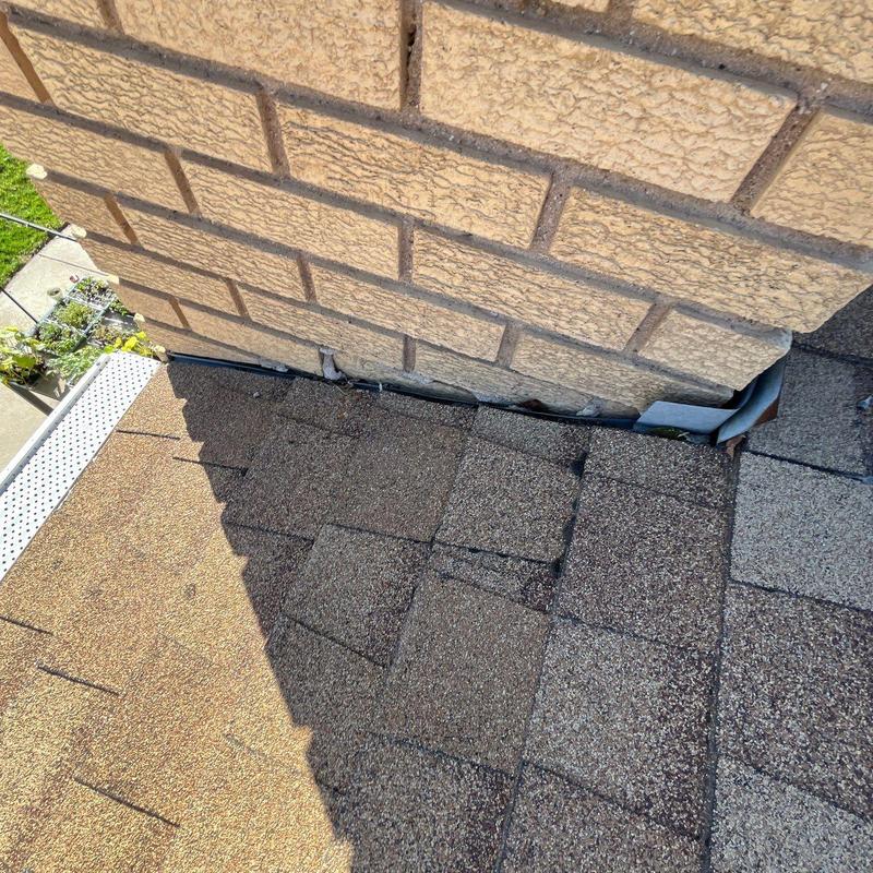 Asphalt shingle roof flashing and drainage inspection