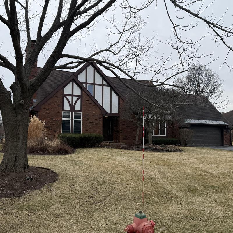 Asphalt roof with gutters and James Hardie siding