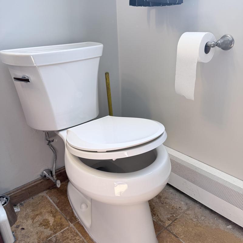 Toilet with new emergency shut off valve in bathroom