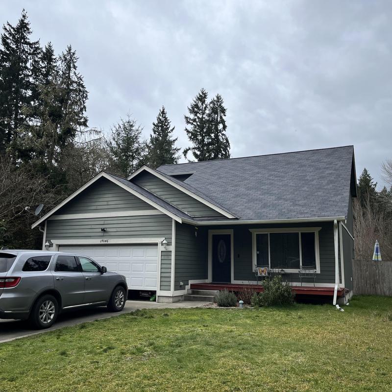 Roof shingles inspection on residential house with garage Roof shingles inspection on residential house with garage