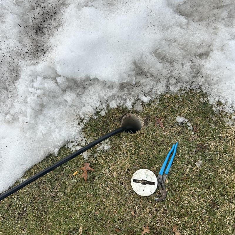 Hydro-jet pipe cleaning with tools near snow and grass