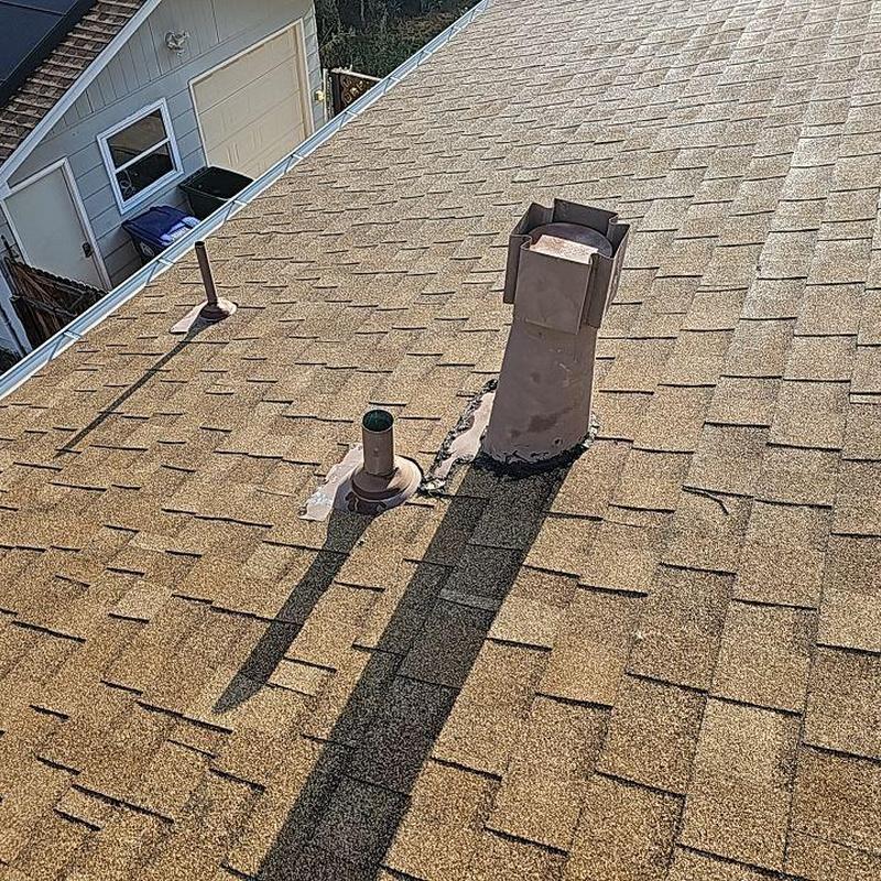 Shingle roof with vent pipe flashing and hail damage Shingle roof with vent pipe flashing and hail damage