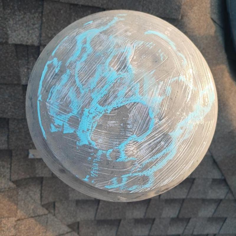 Roof vent cap with chalk markings on shingles