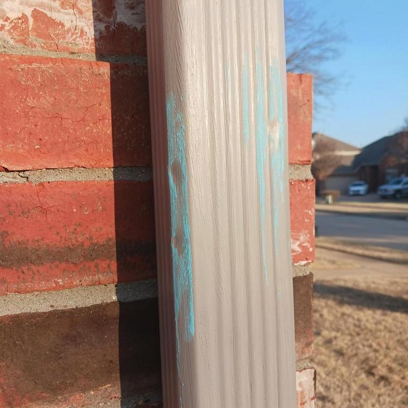 Seamless gutter downspout with minor paint marks