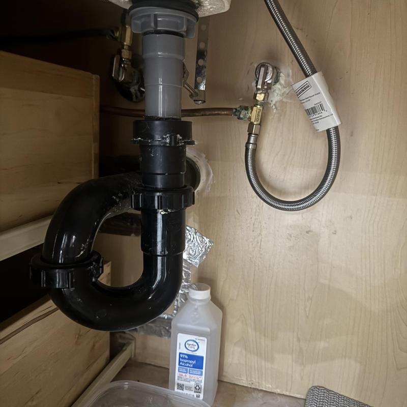 Pop-up drain pipe and supply line under sink