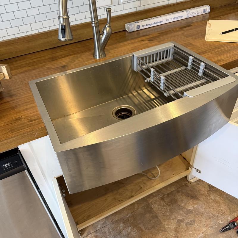Stainless steel kitchen sink with faucet installation