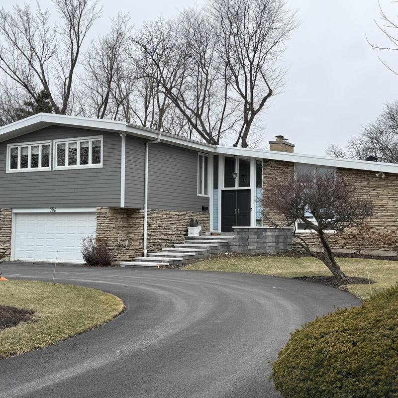 James Hardie siding with stone facade and gutters