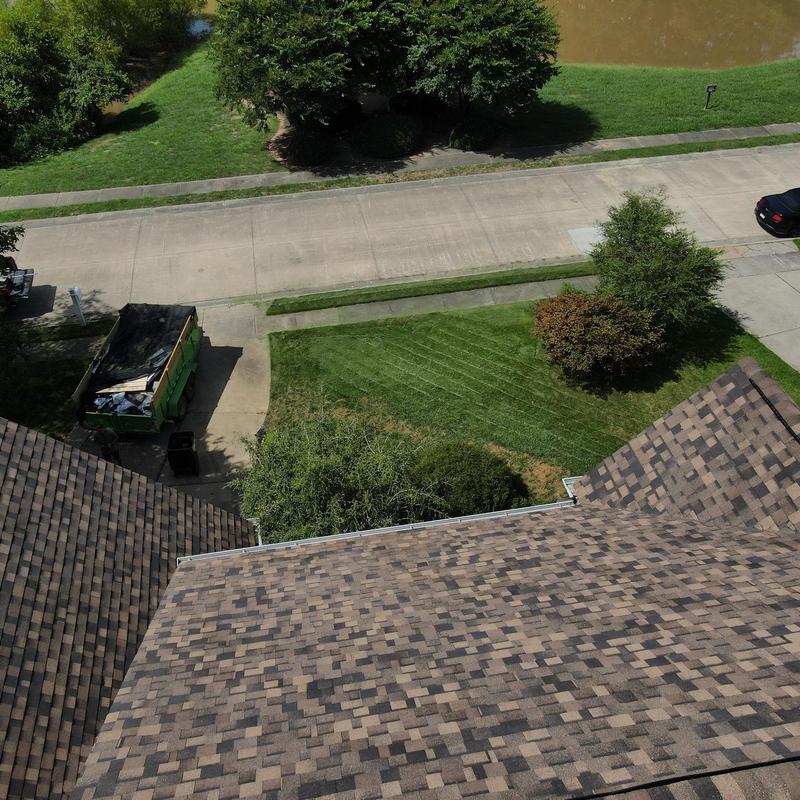 IKO Dynasty Brownstone shingles on residential roof IKO Dynasty Brownstone shingles on residential roof