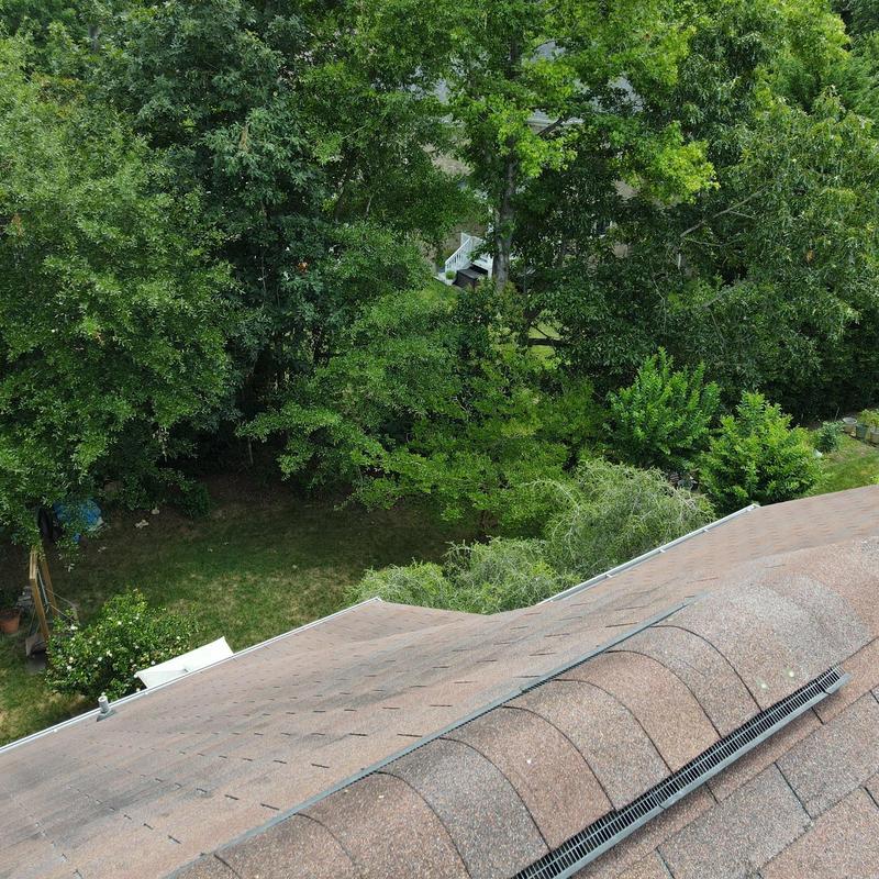 IKO Dynasty Brownstone roof with new gutter downspouts IKO Dynasty Brownstone roof with new gutter downspouts