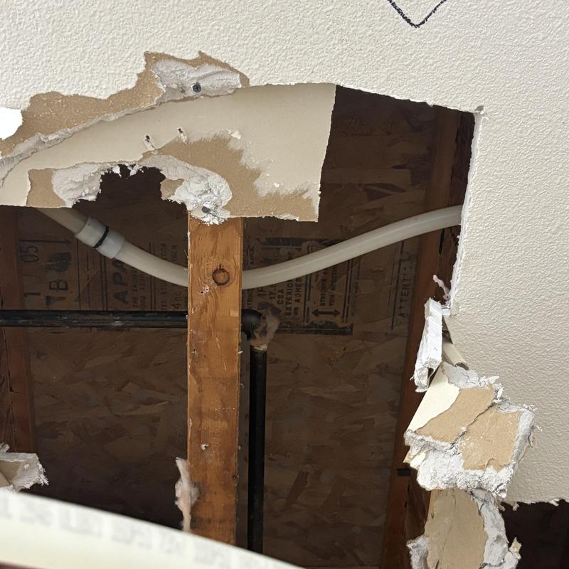 PEX water line cracked behind ceiling drywall damage