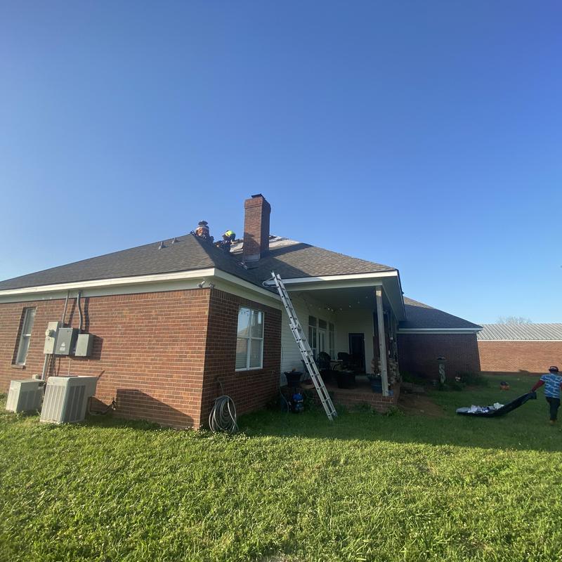 Duration shingle roof installation on brick house