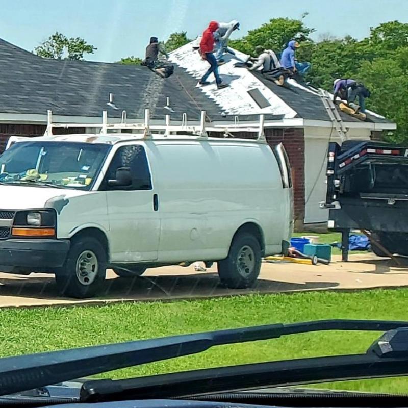 Roof shingles replacement on residential home after hail damage