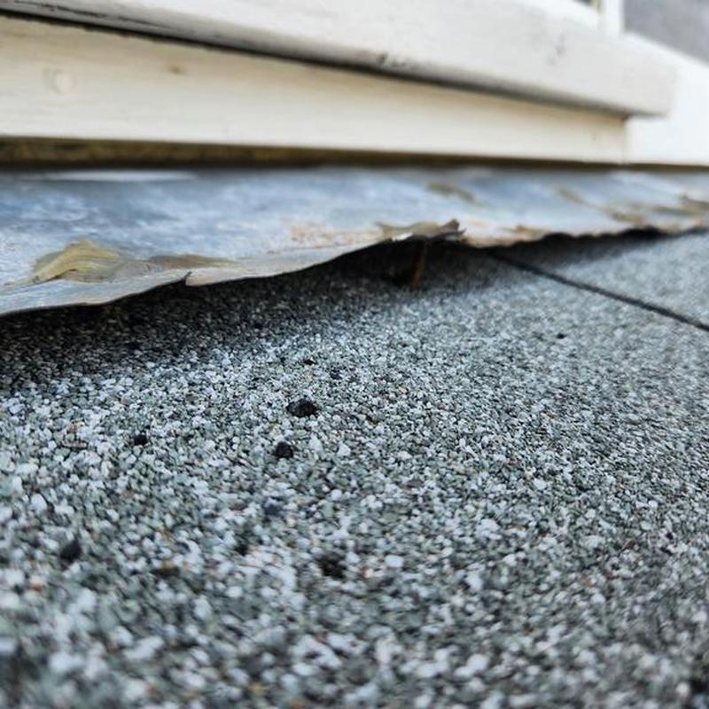 Patio roof edge with damaged metal flashing