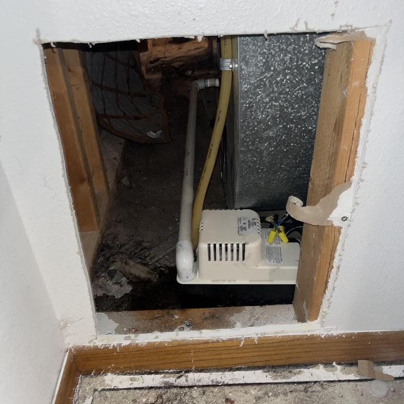 Condensate pump replacement for gas furnace in wall cavity