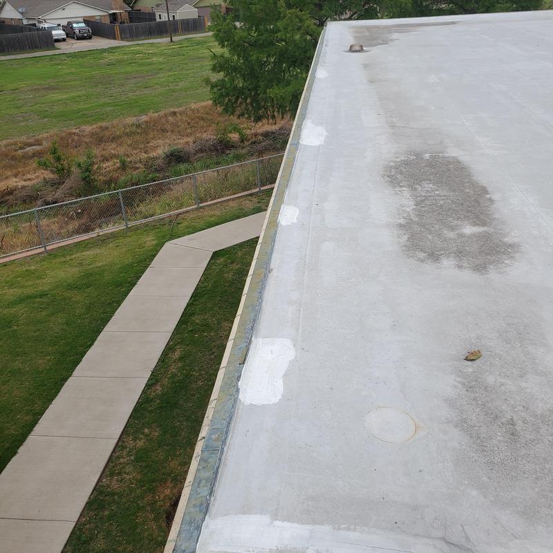 Flat roof membrane with hail damage patches