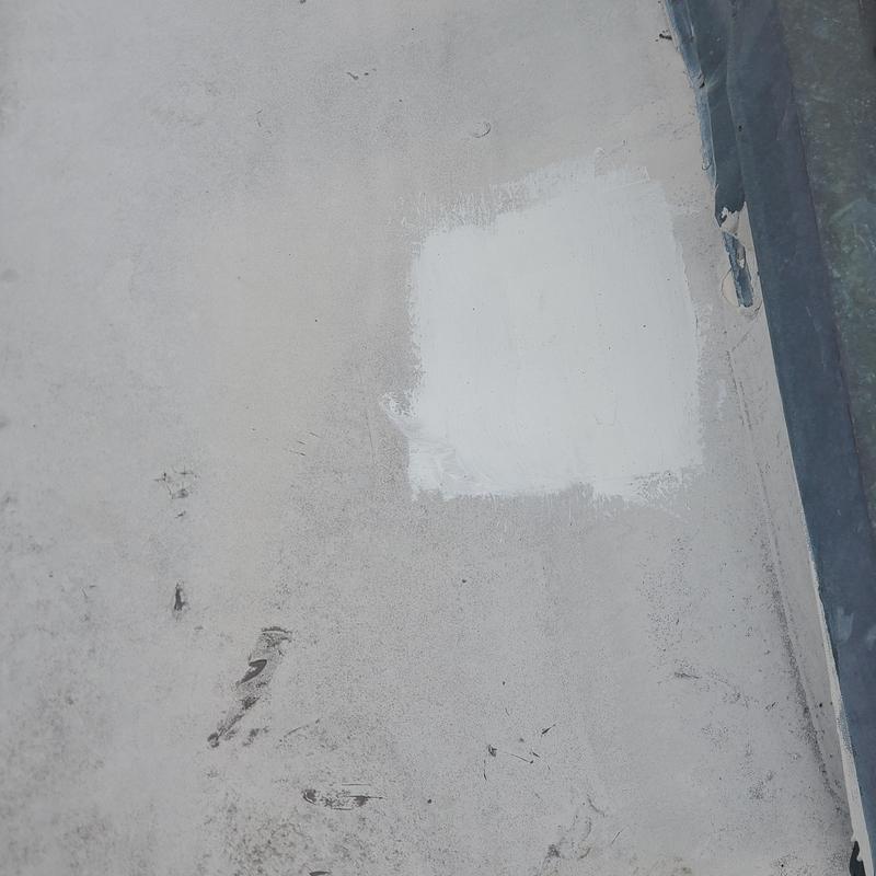 Flat roof surface patch after hail damage repair