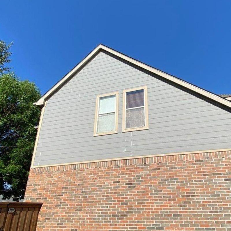LP SmartSide siding and trim installation on house exterior