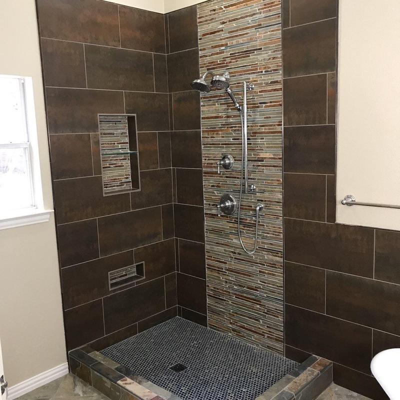 Shower with mosaic tile accent and built-in niches Shower with mosaic tile accent and built-in niches