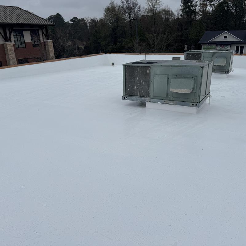 Flat roof silicone coating with HVAC units