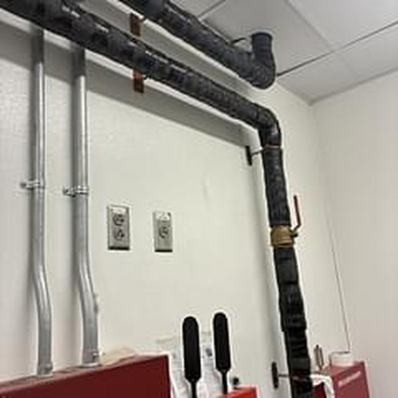 Insulated mechanical room pipes with valves and clamps