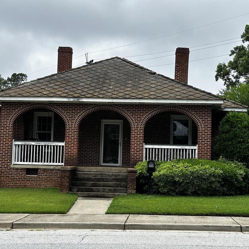 Asbestos roof with diamond pattern shingles and chimneys Asbestos roof with diamond pattern shingles and chimneys