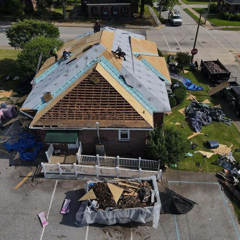 Roof decking and underlayment installation on house roof Roof decking and underlayment installation on house roof