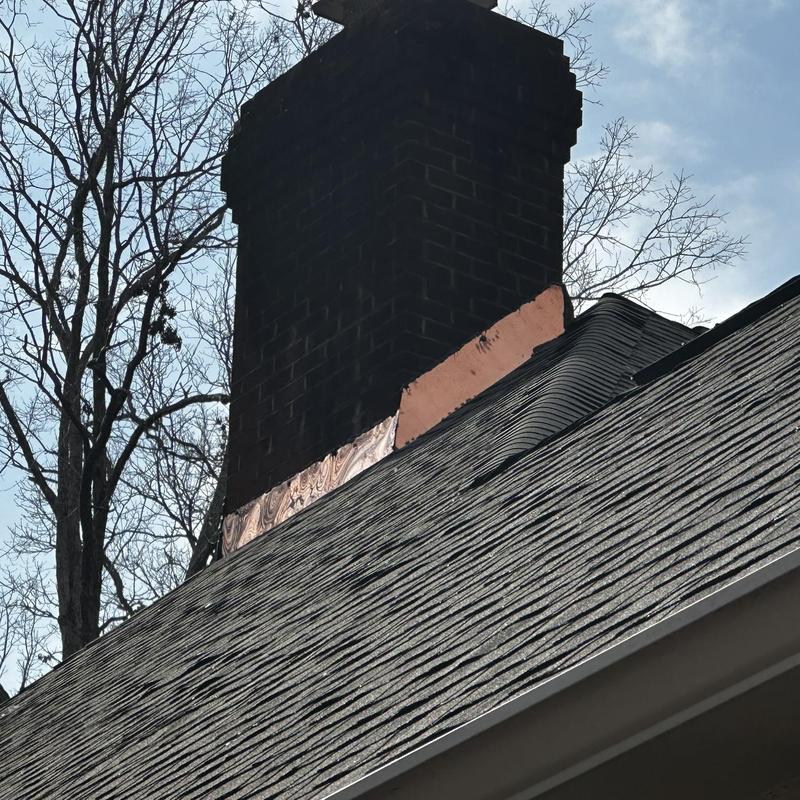 Copper chimney flashing on Owens Corning shingle roof Copper chimney flashing on Owens Corning shingle roof