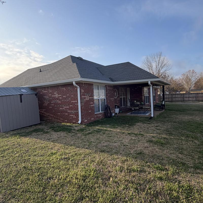 6 inch white seamless gutters on brick house exterior