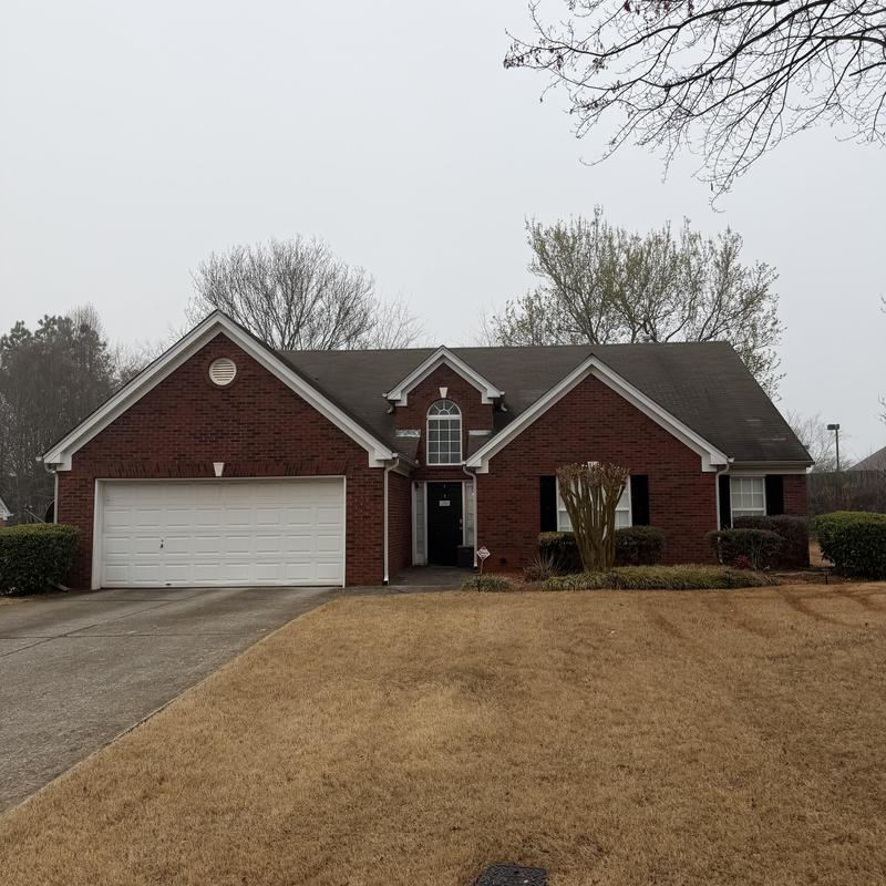 3-tab shingle roof with missing shingles on house