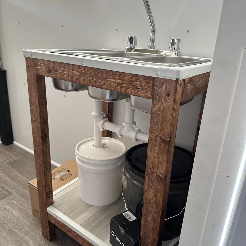 Food truck double sink plumbing setup with buckets
