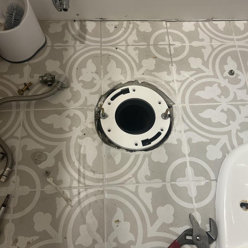 Toilet flange replacement on patterned tile floor Toilet flange replacement on patterned tile floor