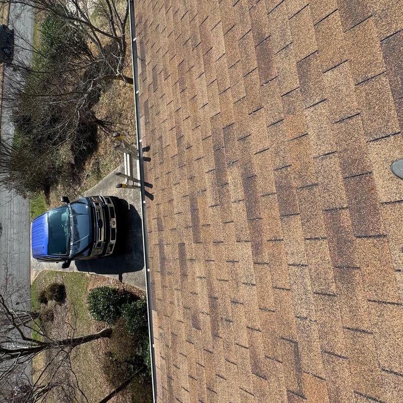 Asphalt shingle roof inspection from rooftop view