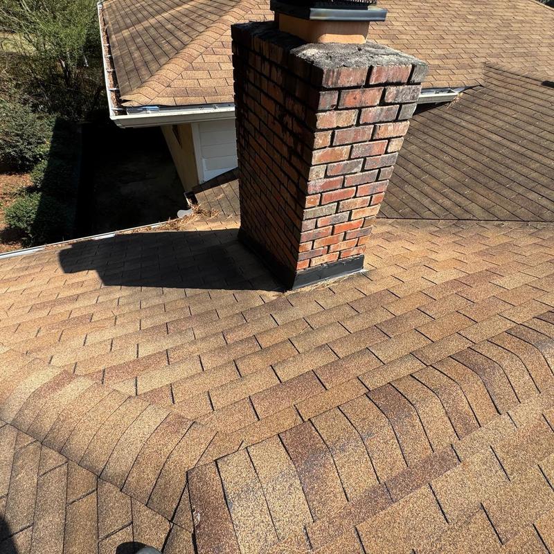 Brick chimney flashing and asphalt shingle roof inspection