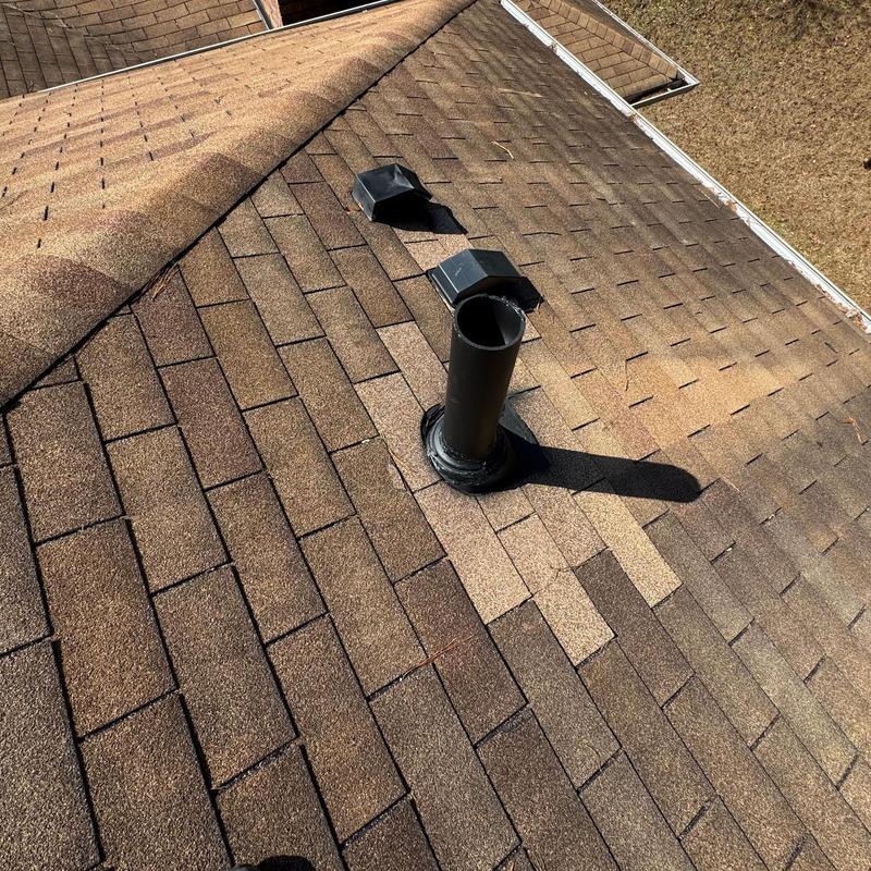 Roof vent pipe and replacement shingles on asphalt roof