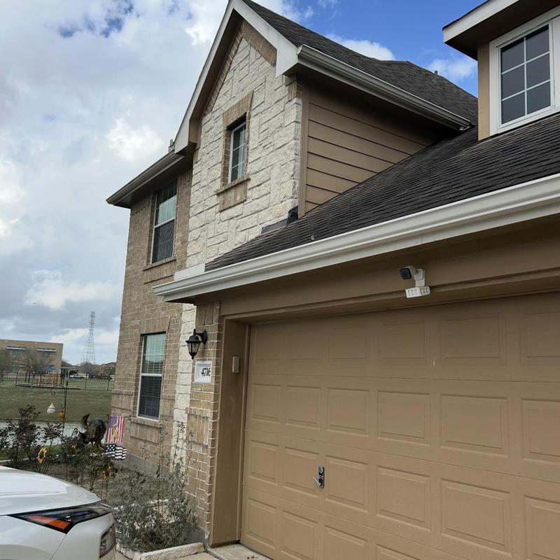 Asphalt shingle roof with ridge cap inspection