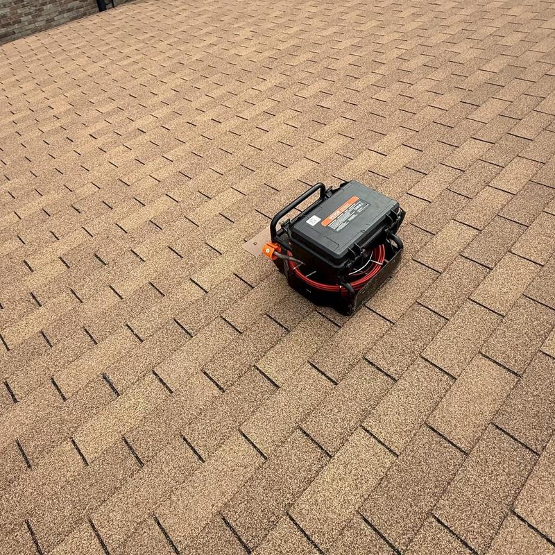 Sewer pipe camera inspection on shingled roof
