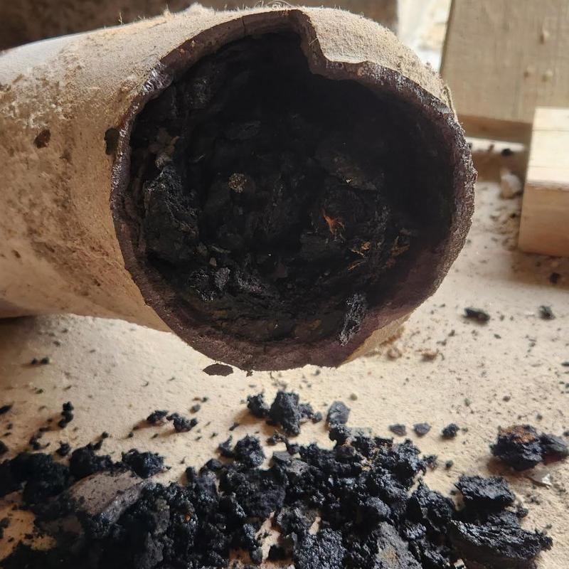 Cast iron drain pipe with heavy buildup debris