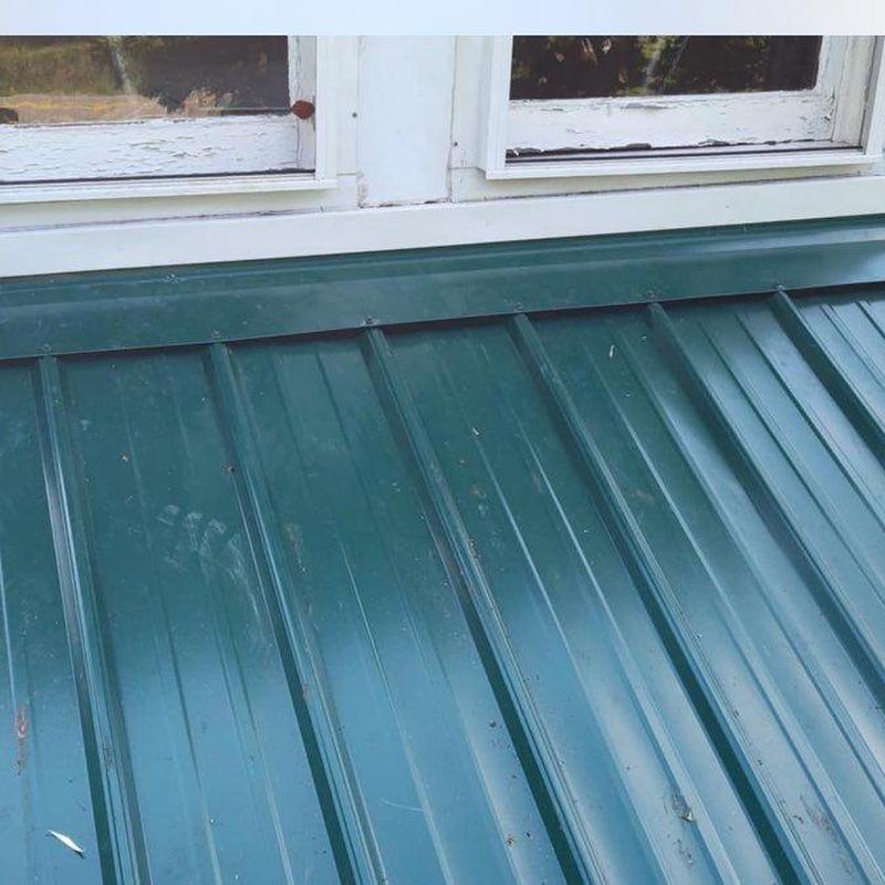 Metal roof panels and window flashing inspection detail