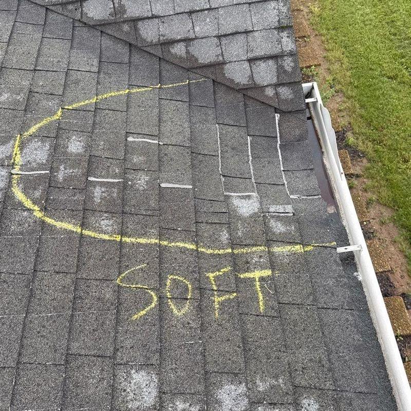 Asphalt shingle roof with hail damage and soft spots marked