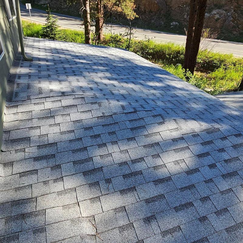 Asphalt shingle roof with granule loss and damage Asphalt shingle roof with granule loss and damage