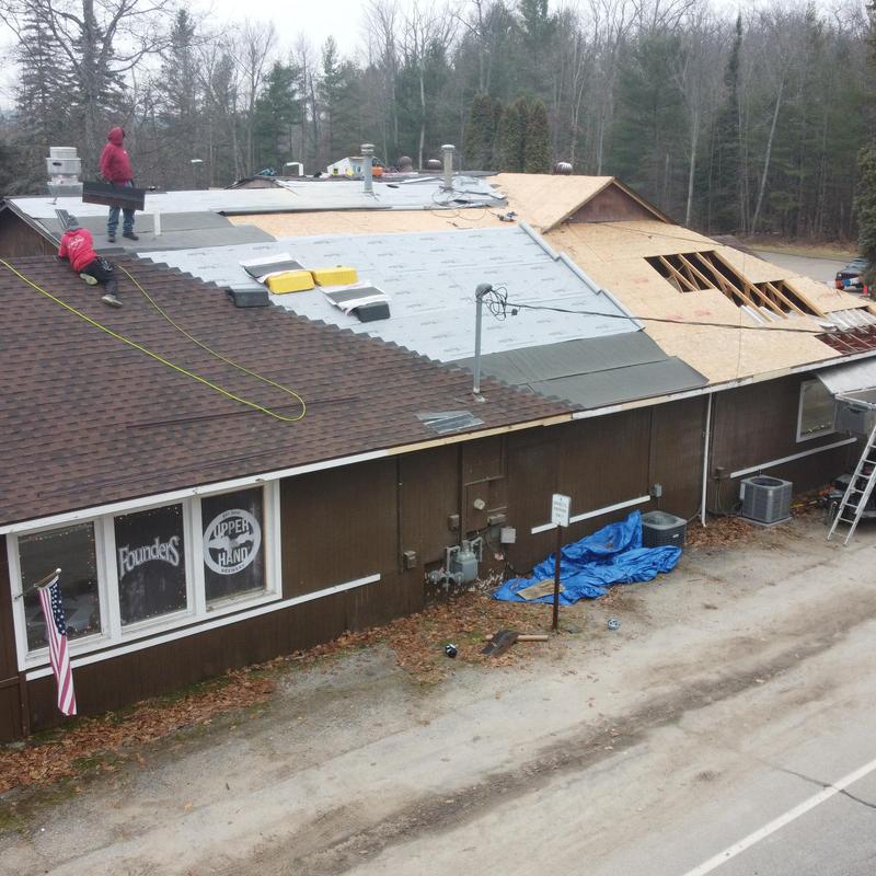 Asphalt shingle roof installation with deck repair
