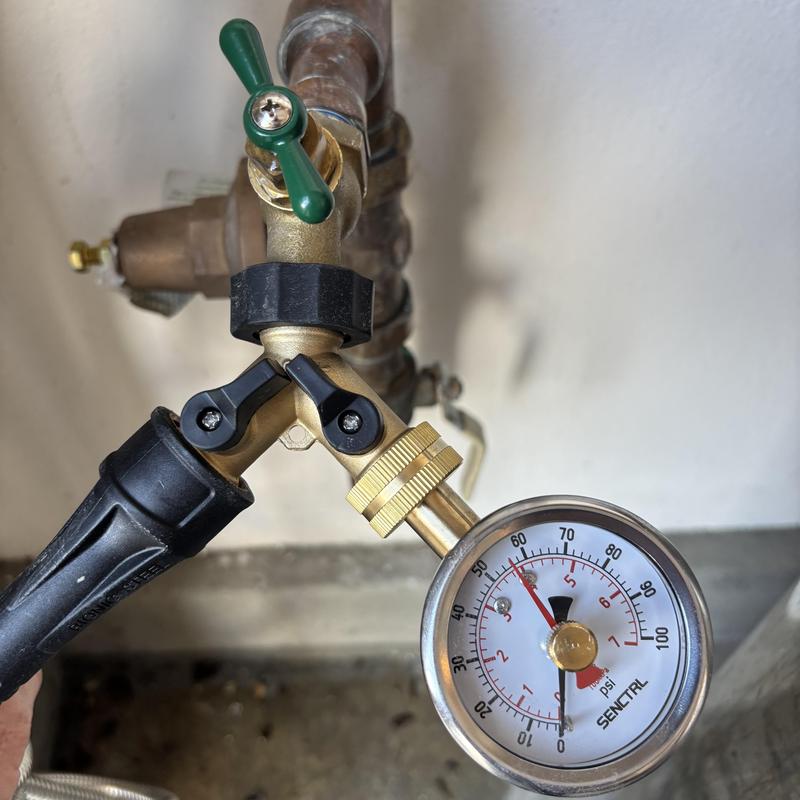 Pressure regulator valve with gauge at 55 psi measurement Pressure regulator valve with gauge at 55 psi measurement