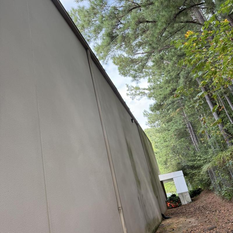 Commercial aluminum downspouts on three-story building