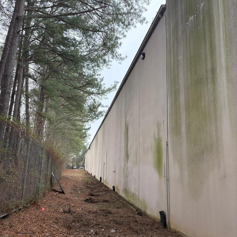 Commercial grade aluminum downspouts on building wall