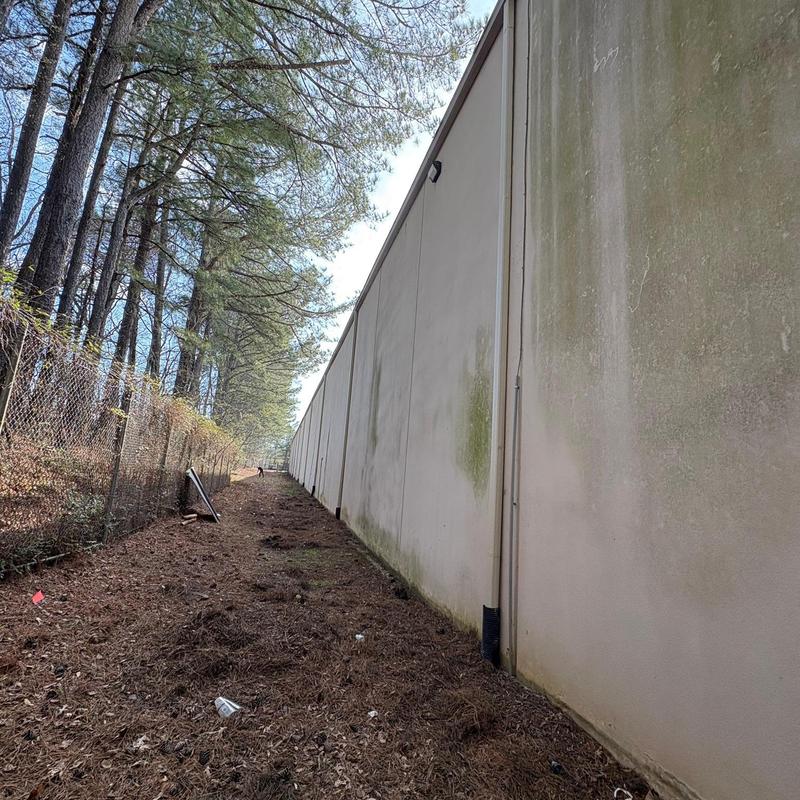 Commercial aluminum downspouts on three-story building